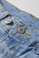Beau Blue Asymmetric Raw Hem Distressed Whiskery Denim Shorts